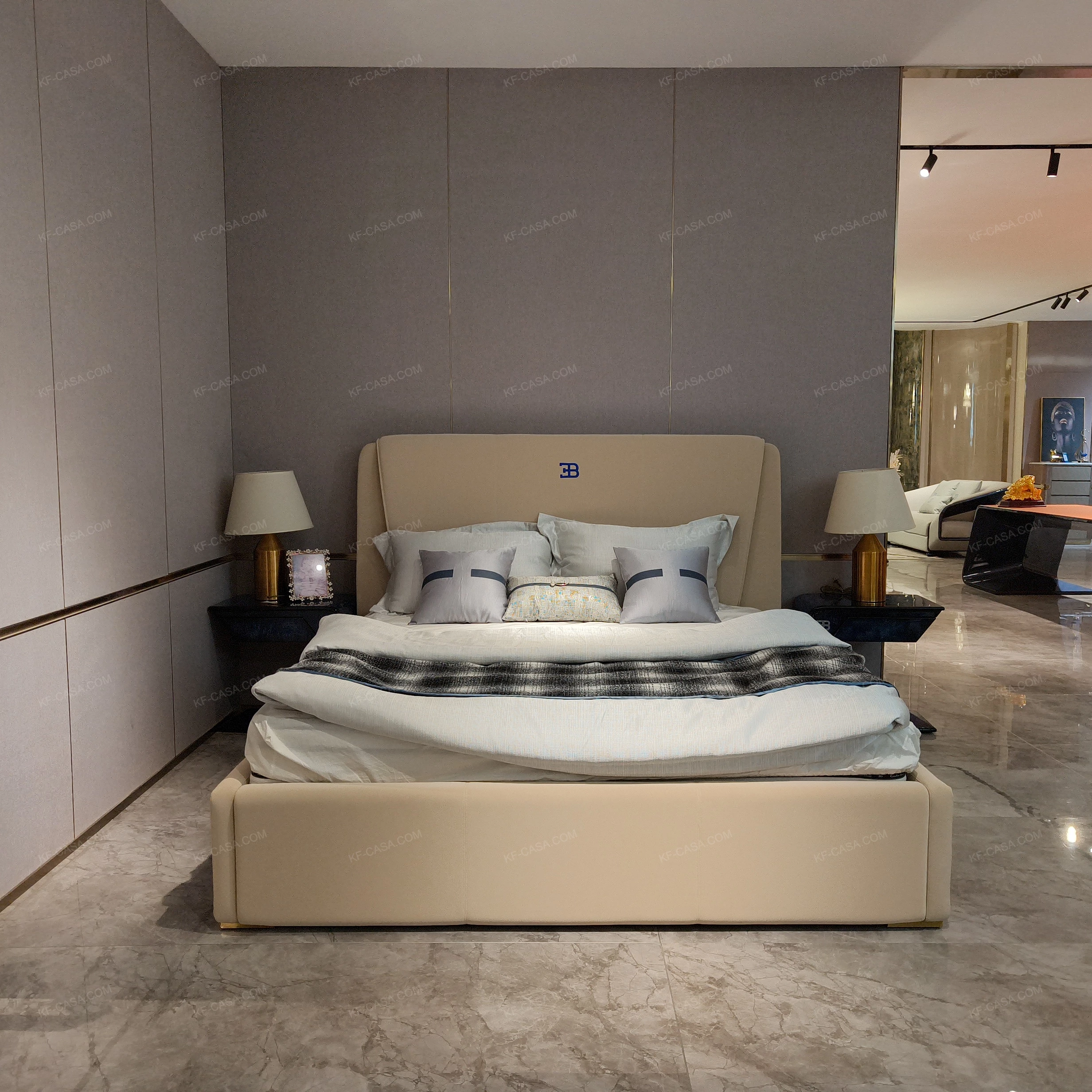 Light Beige Upholstered Bed with Brand Emblem, Navy Accent Stripe & Gold Stainless Steel Feet